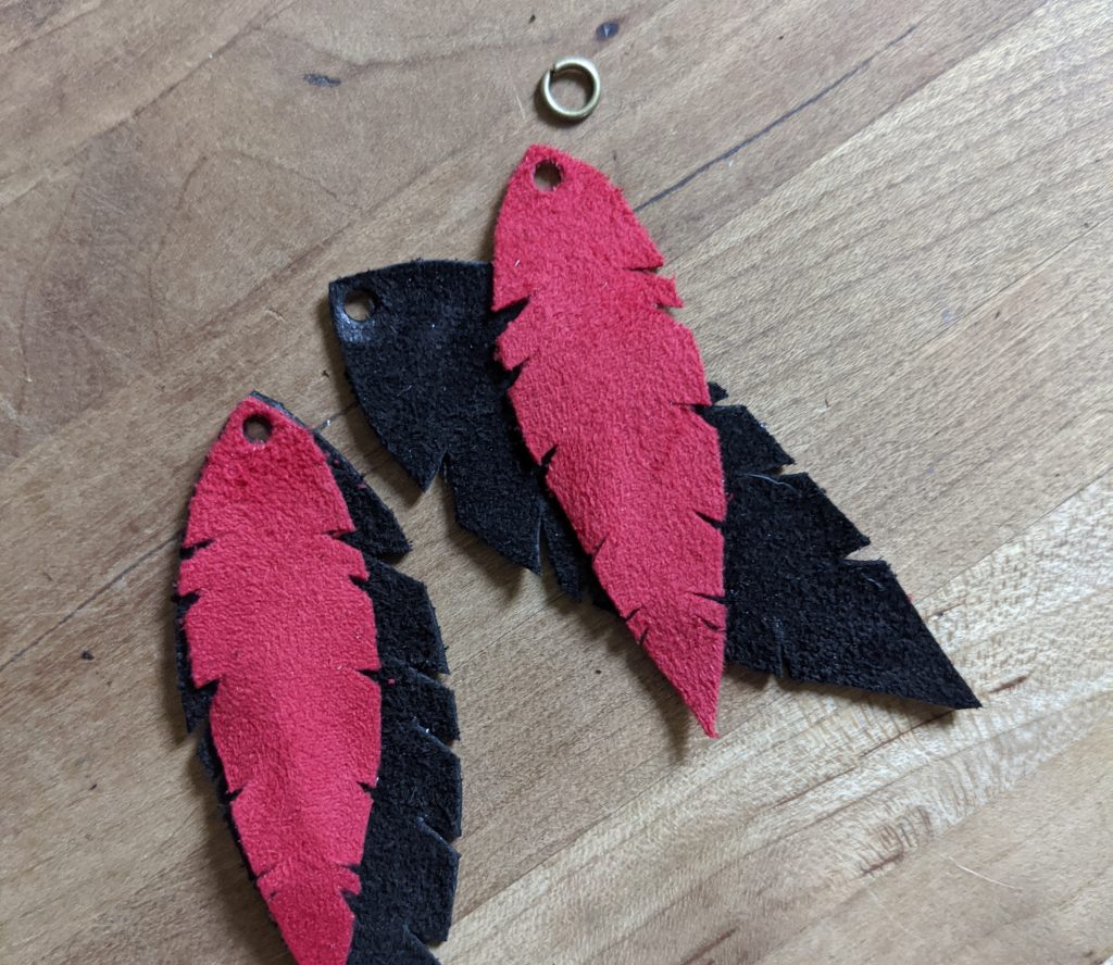 DIY Leather Feather Earrings. DIY Craft. Leather Craft. Inspired by The Unclaimed Series by Laurie Wetzel. Directions at themamavillage.com